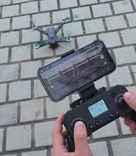 GPS drone and screen remote set up for an outdoor test flight
